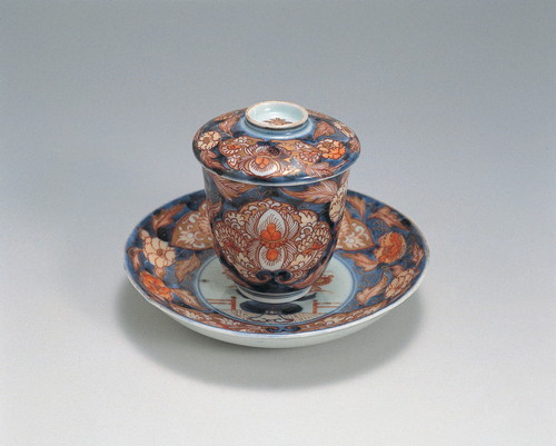 Small lidded bowl with flower in a vase and scrolling peony design in overglaze polychrome enamels
