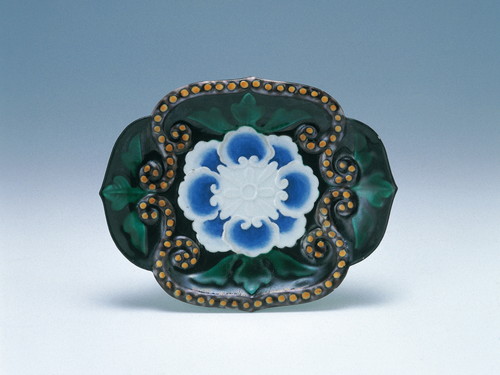 Irregular-shaped dish with stylized flower design in overglaze polychrome enamels