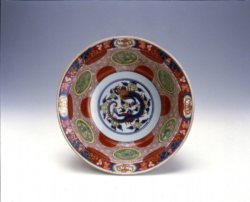 Bowl with dragon, red roundel, and cloud design in overglaze polychrome enamels