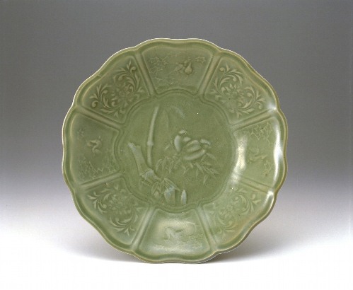 Large lobed dish with sparrow, deer, bamboo, maple, and scrolling flower design in celadon glaze