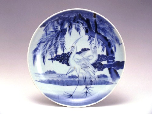 Large dish with heron and willow design in underglaze cobalt blue