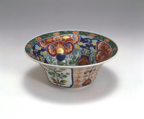 Bowl with flowering plants, cloud, and linked diaper pattern design in overglaze polychrome enamels