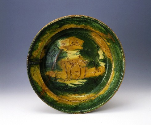 Large basin with human figure design in three-color glaze