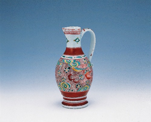 Handled ewer with scattered plum blossoms design in overglaze polychrome enamels