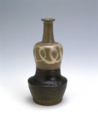 <i>Tonaki</i> bottle with linked circles design in iron brown glaze