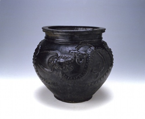 Jar with applied dragon design in dark-brown glaze