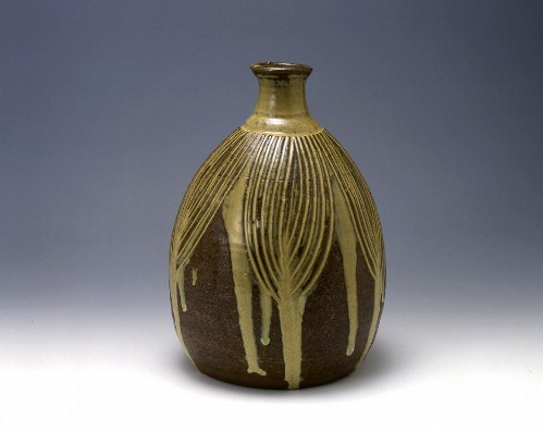 Bottle with incised design in trailed straw-ash glaze