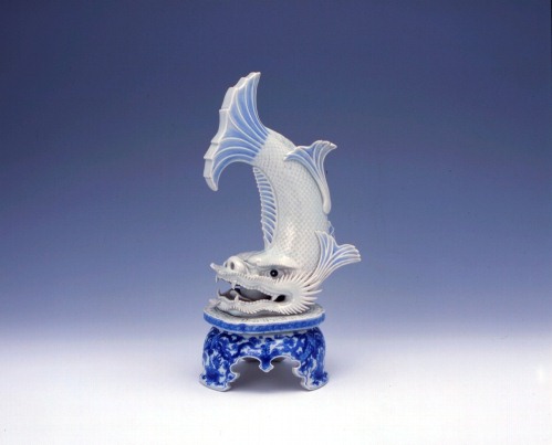 Figurine of fabulous dolphin-like fish with phoenix and paulownia design in underglaze cobalt blue